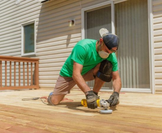 Wooden deck undergoing sanding for refinishing