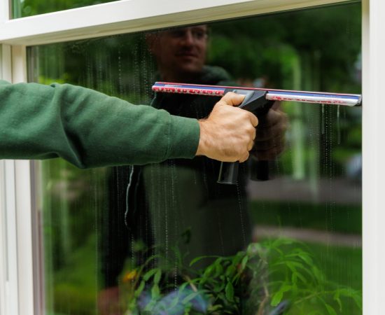 squeegee is used to clean a window